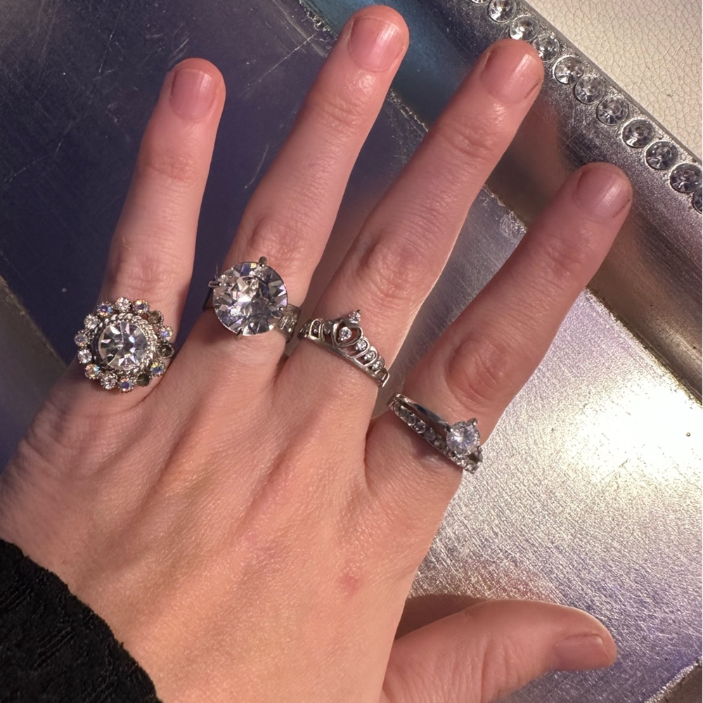 Set of four silver costume jewelry rings